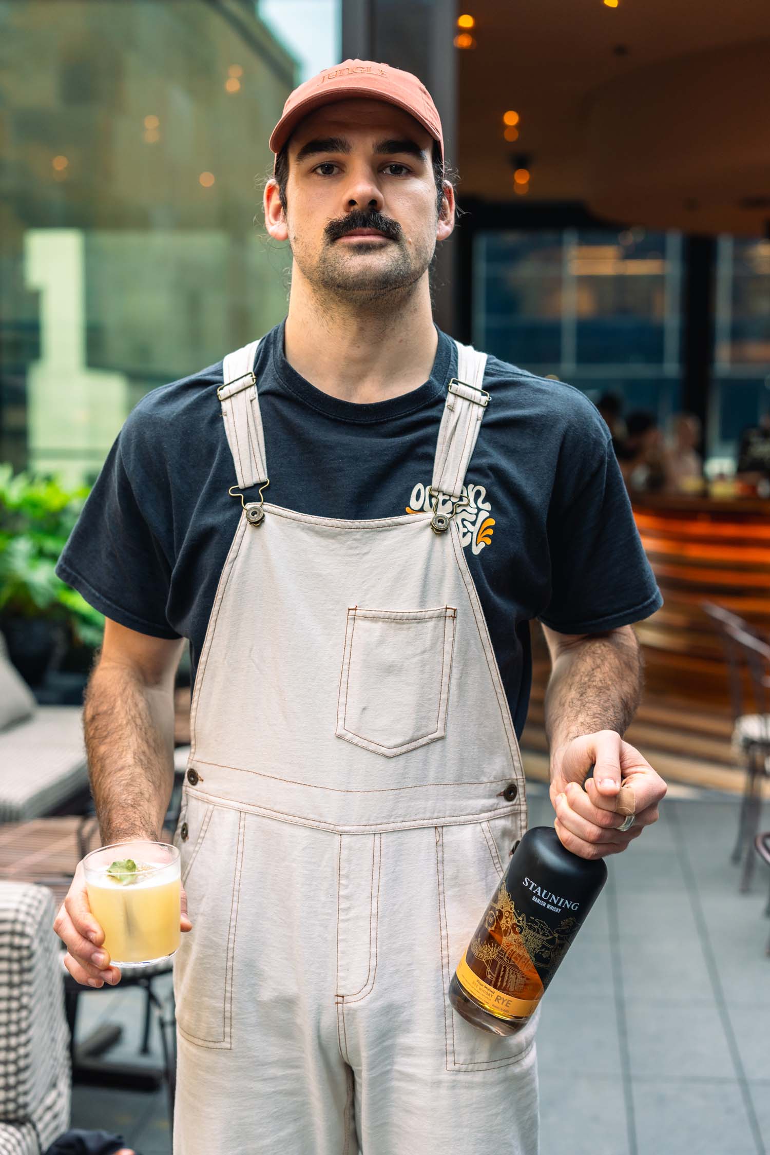 Tom Opie with his drink Ubuntu, and Stauning Rye. Photo: Supplied